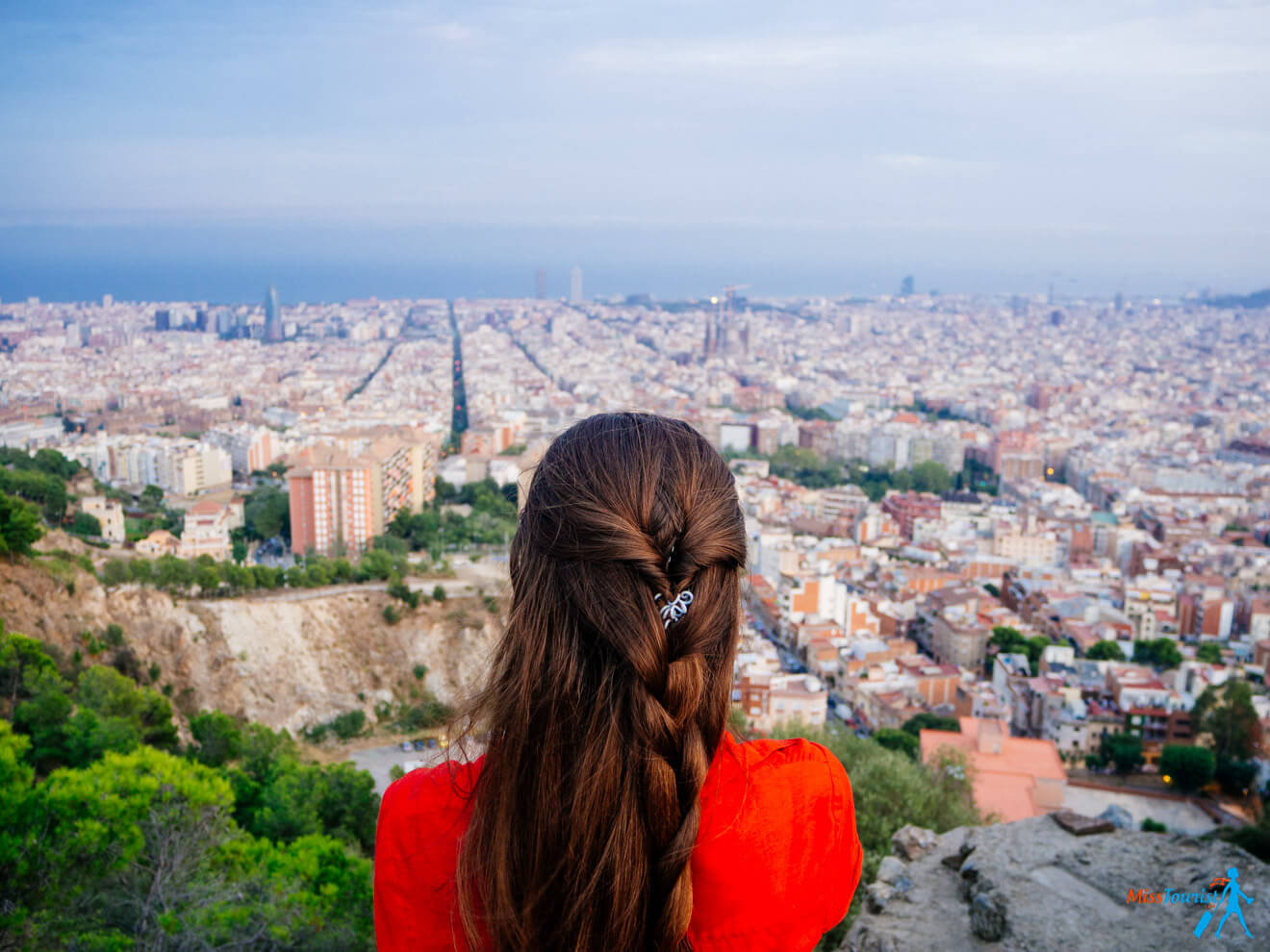 author of the post looking out over the city of barcelona.