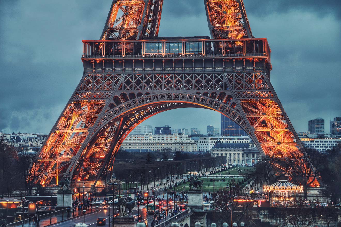 The eiffel tower is lit up at night.