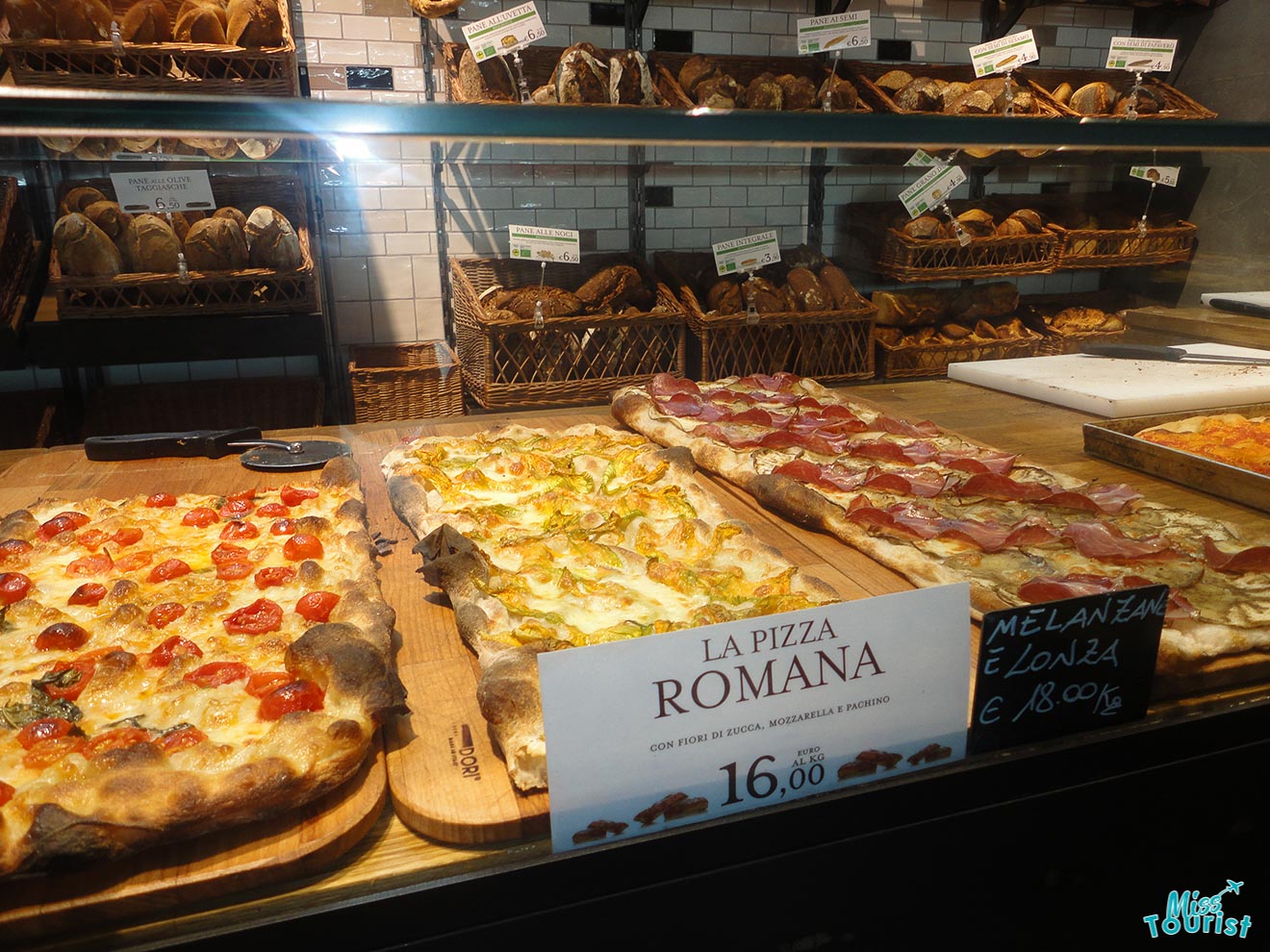 pizza behind a counter