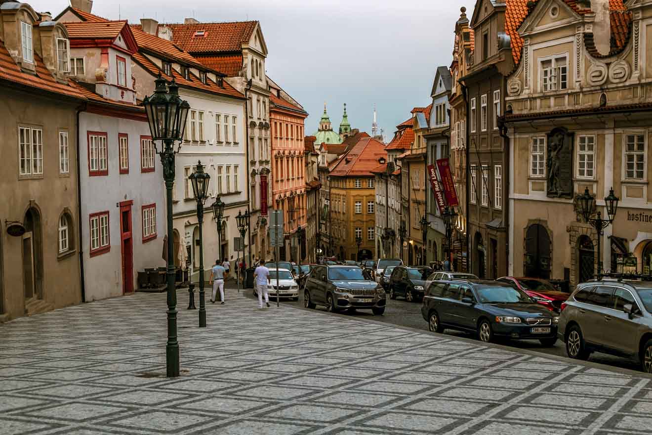 A street in prague with cars parked on it.