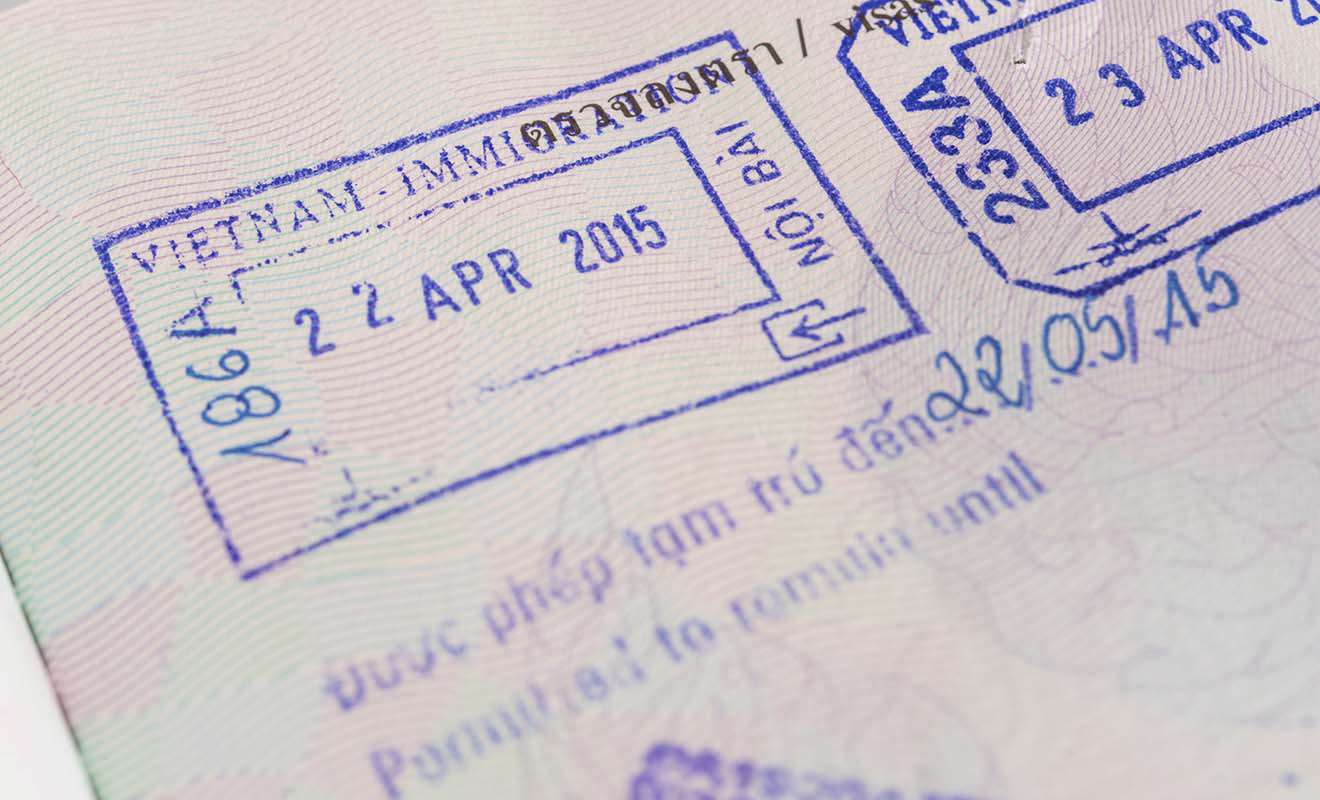 Close-up of a passport page showing immigration stamps from Vietnam dated April 22, 2015.