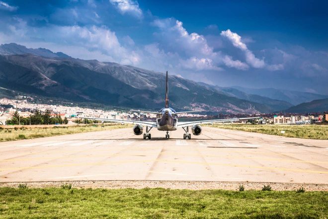 passenger plane at airport lane