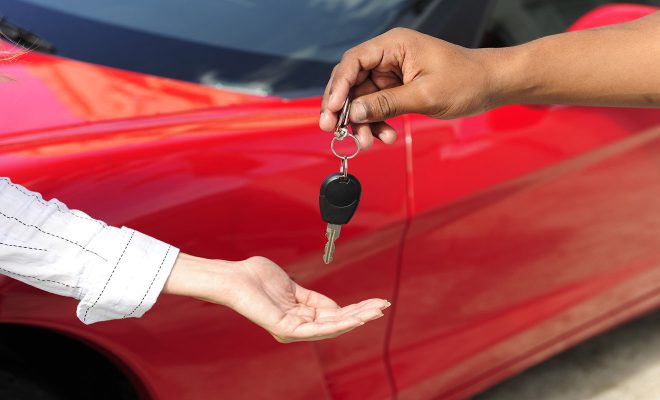 woman red car keys