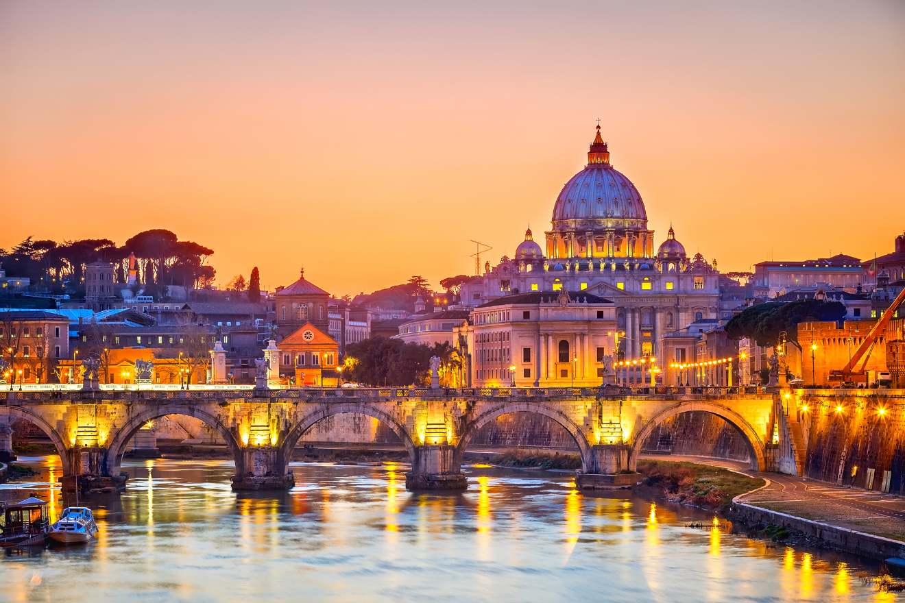 a bridge over a river with a building in the background