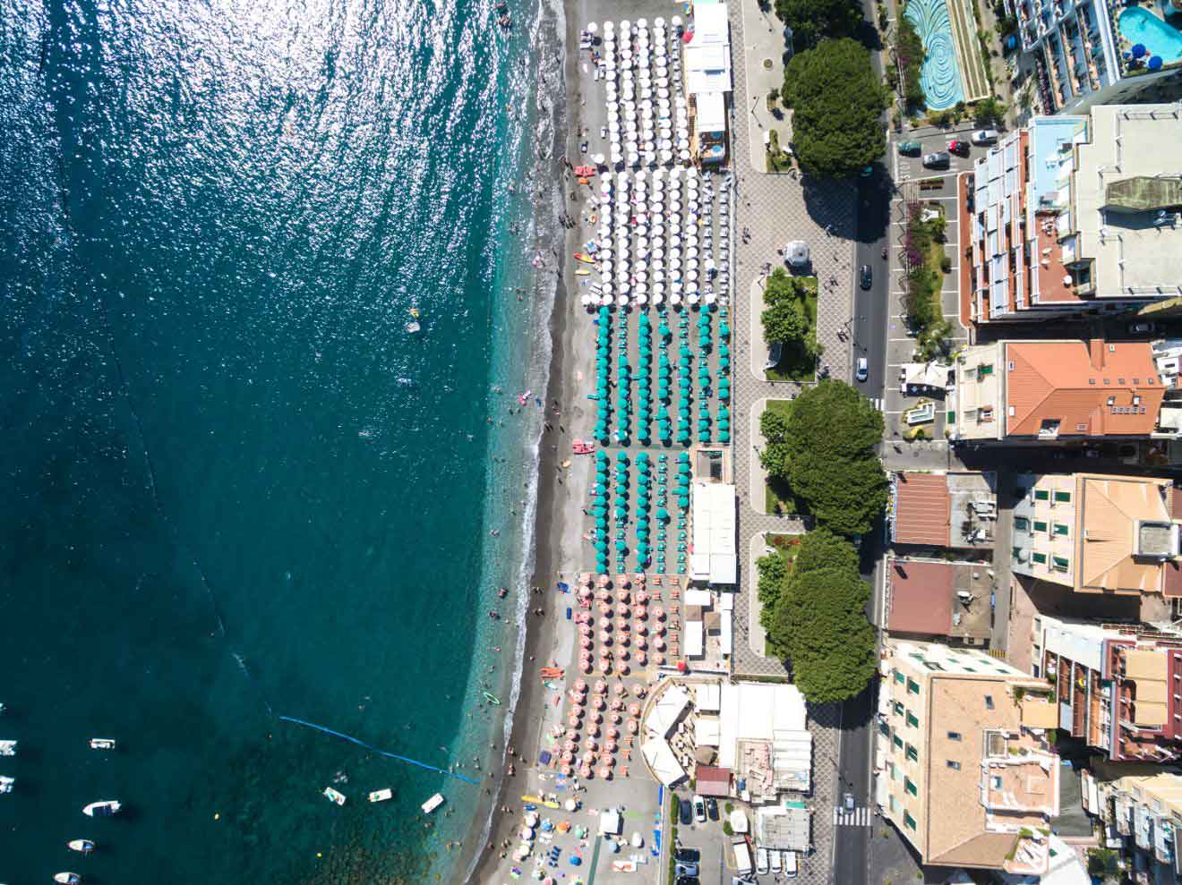An aerial view of a beach and ocean in the towns of Maiori and Minor on the Amalfi Coast, Italy