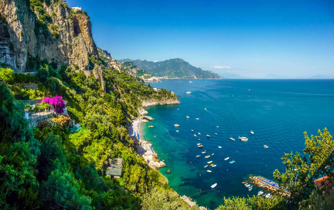 Aerial view of the Amalfi Coast with beaches and boats on the water