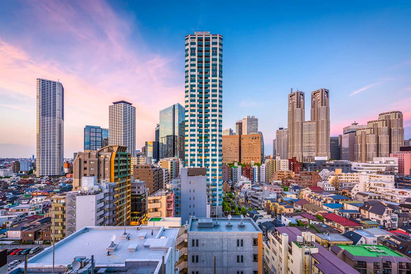 Elevated view of Tokyo’s dense urban landscape at sunset with skyscrapers and a clear sky