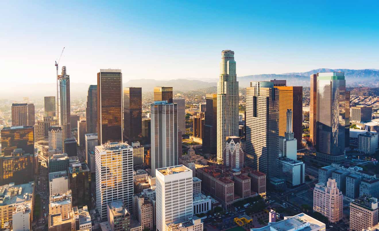 an aerial view of a city with tall buildings