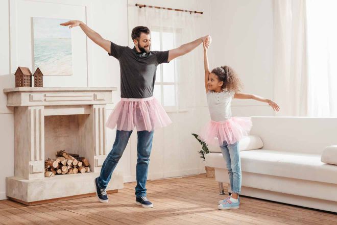 family dancing at home 