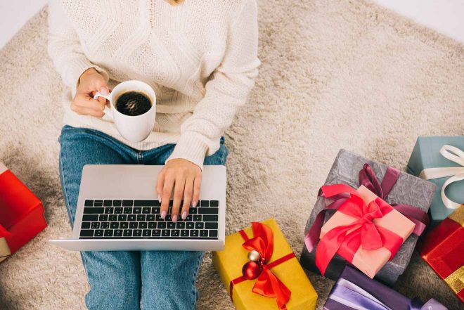 woman with presents coffe and laptop