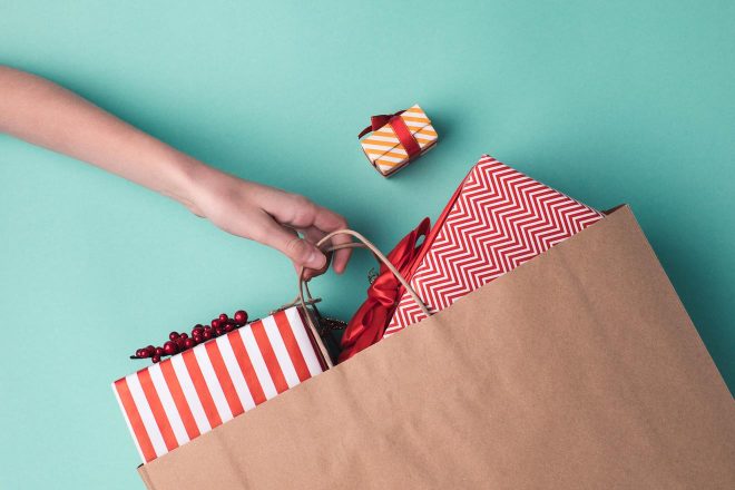 hand holding paper bag