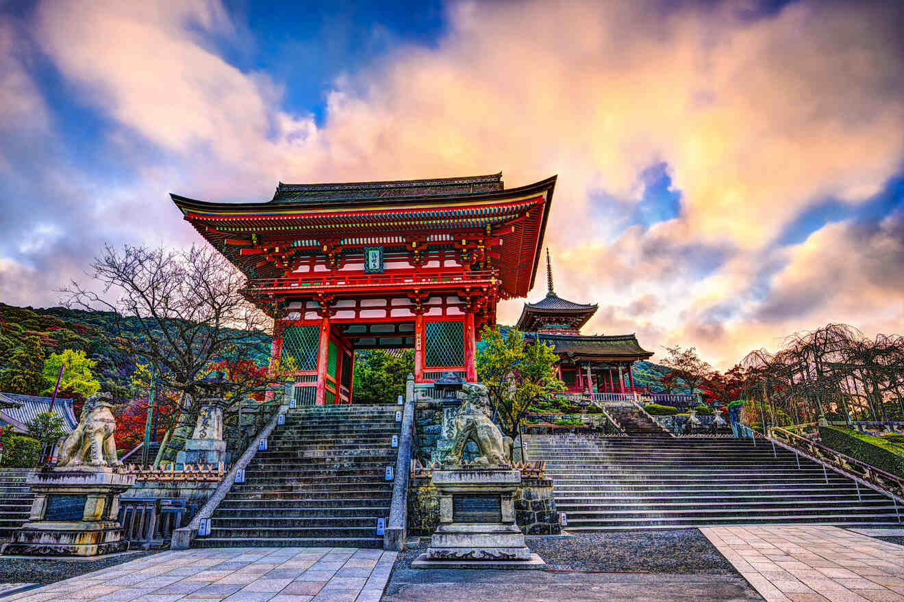 An iconic red torii gate of a Japanese shrine, with a pagoda in the background amidst autumn foliage under a vibrant sunset sky.