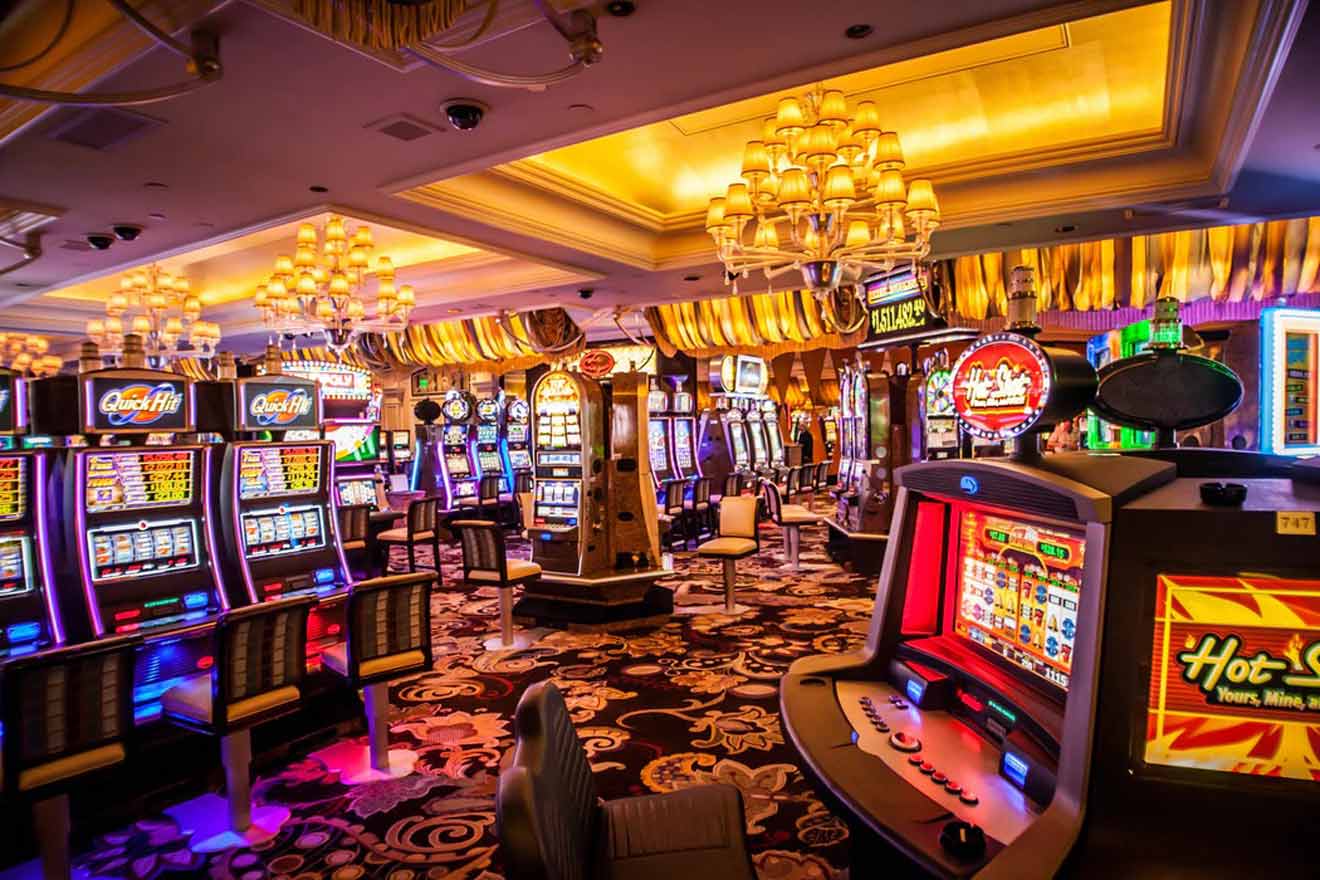 Opulent casino floor filled with an array of slot machines and grandiose chandeliers