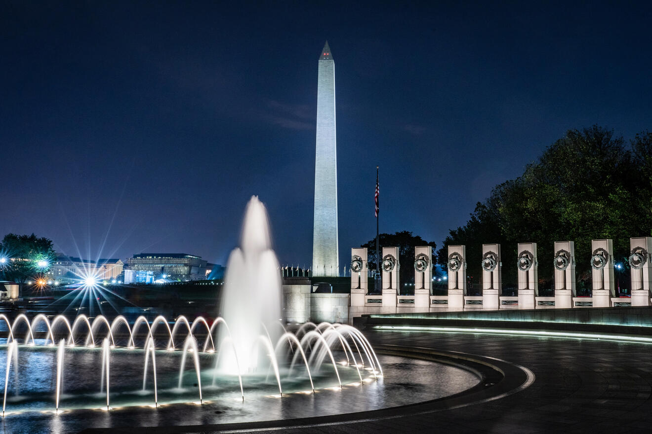 World War II Memorial the washington monument is lit up at night