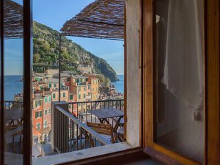 View from a window in a hotel room, overlooking the picturesque buildings