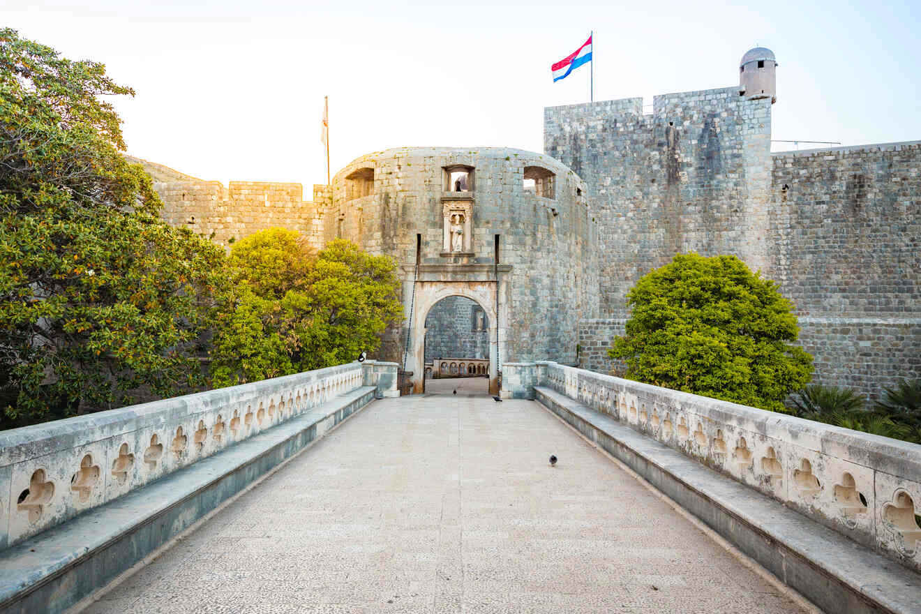 Historic Pile Gate entrance to Dubrovnik's old town with the Croatian flag flying above