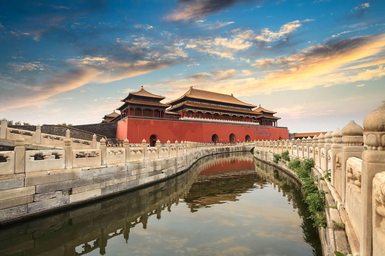 The Forbidden City in Beijing, China, with its iconic red walls and golden rooftops under a picturesque sky