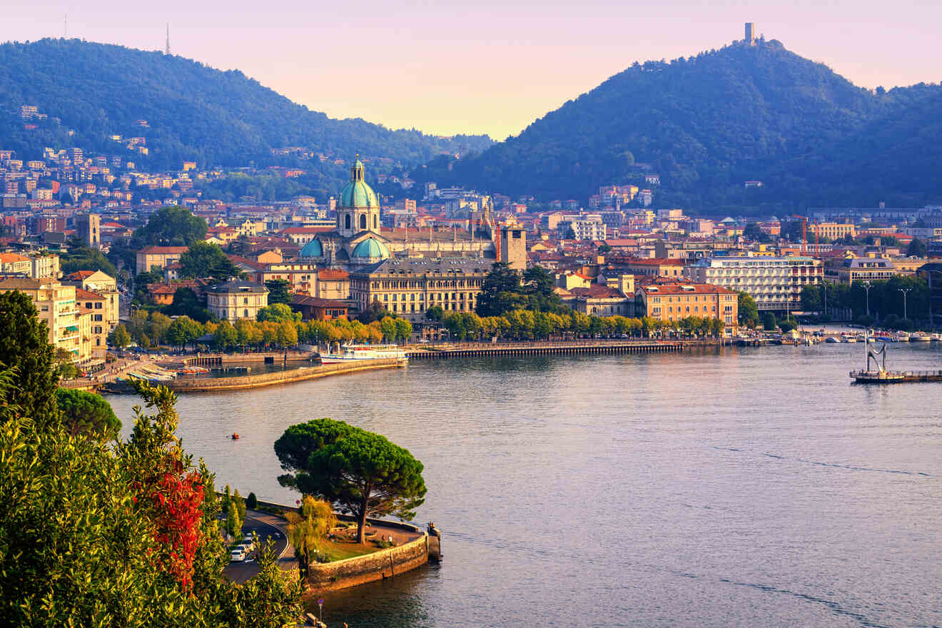 Scenic view of Como town with its historic architecture and cathedral dome, nestled between the lake and hills during sunset hours