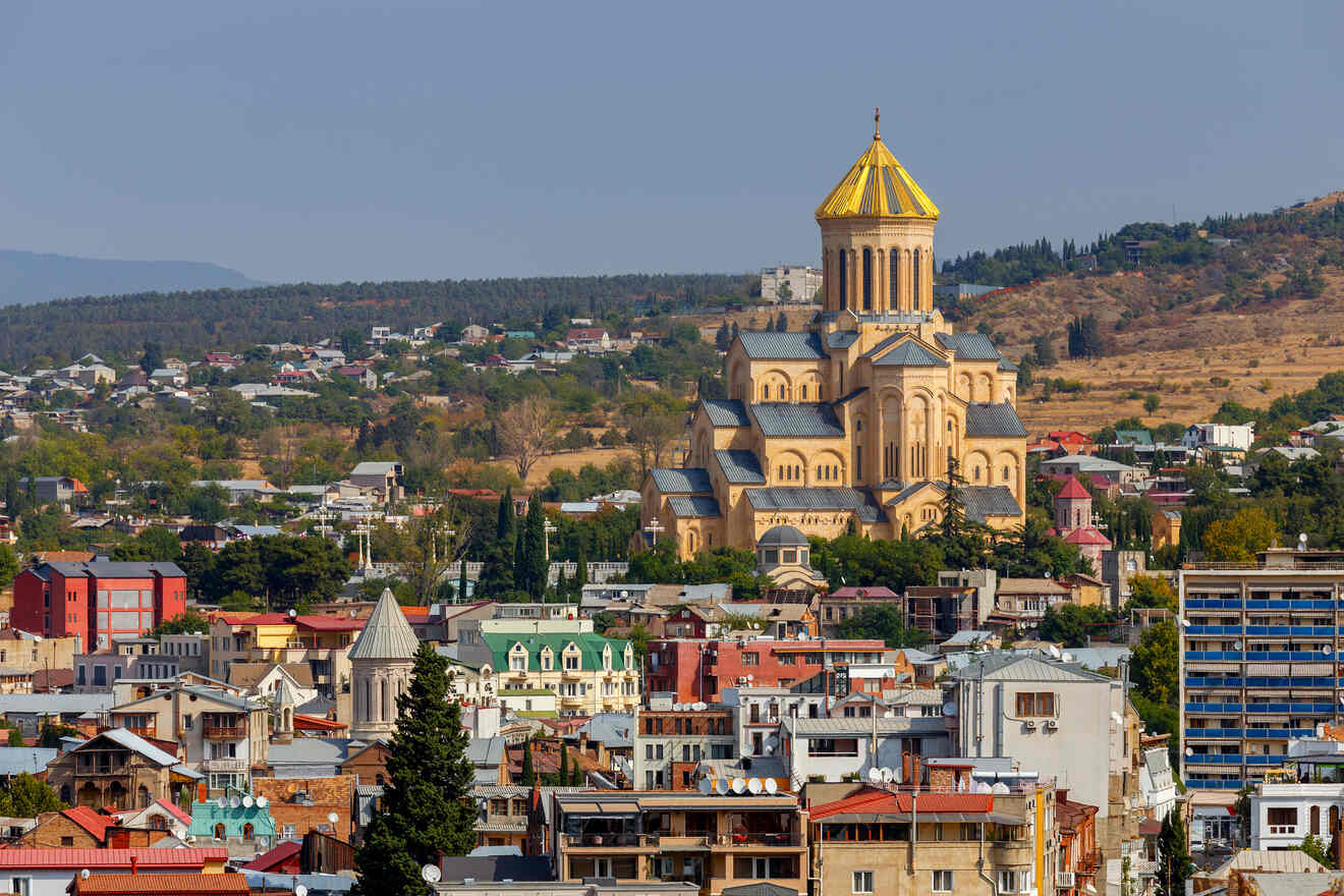 The Holy Trinity Cathedral of Tbilisi, also known as Sameba, towering over the cityscape with its golden dome and traditional Georgian architectural elements