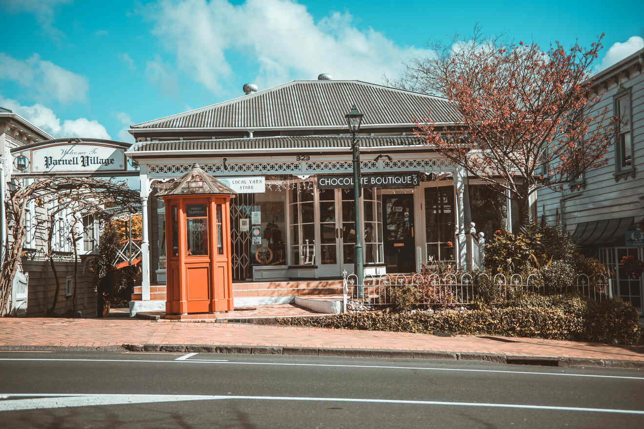 A charming street view of Parnell Village with vintage storefronts, including a chocolate boutique and a local yarn store