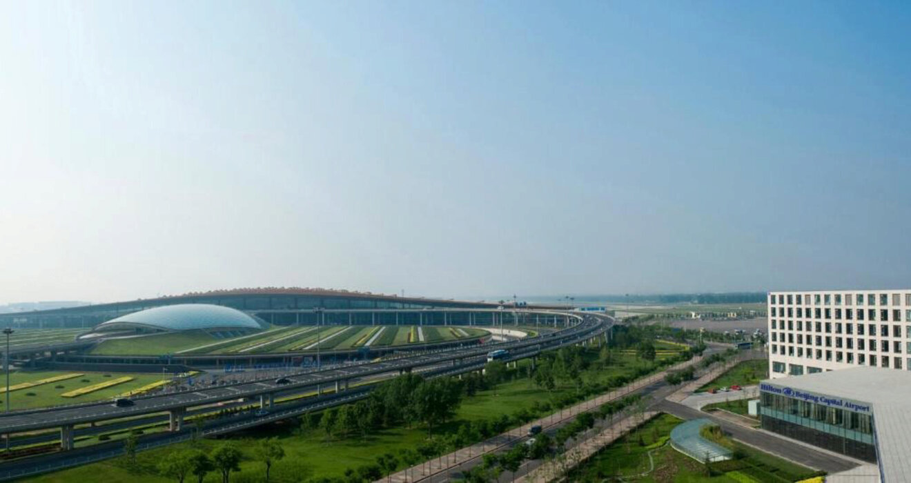 Beijing Capital International Airport with its futuristic design and surrounding greenery