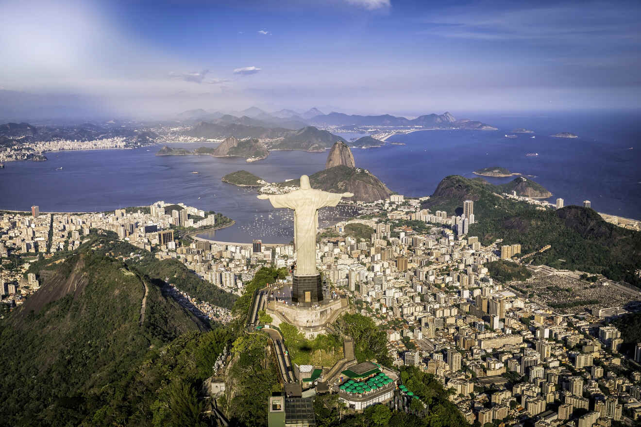 Aerial view of Rio de Janeiro with Christ the Redeemer overlooking the cityscape and Sugarloaf Mountain in the distance