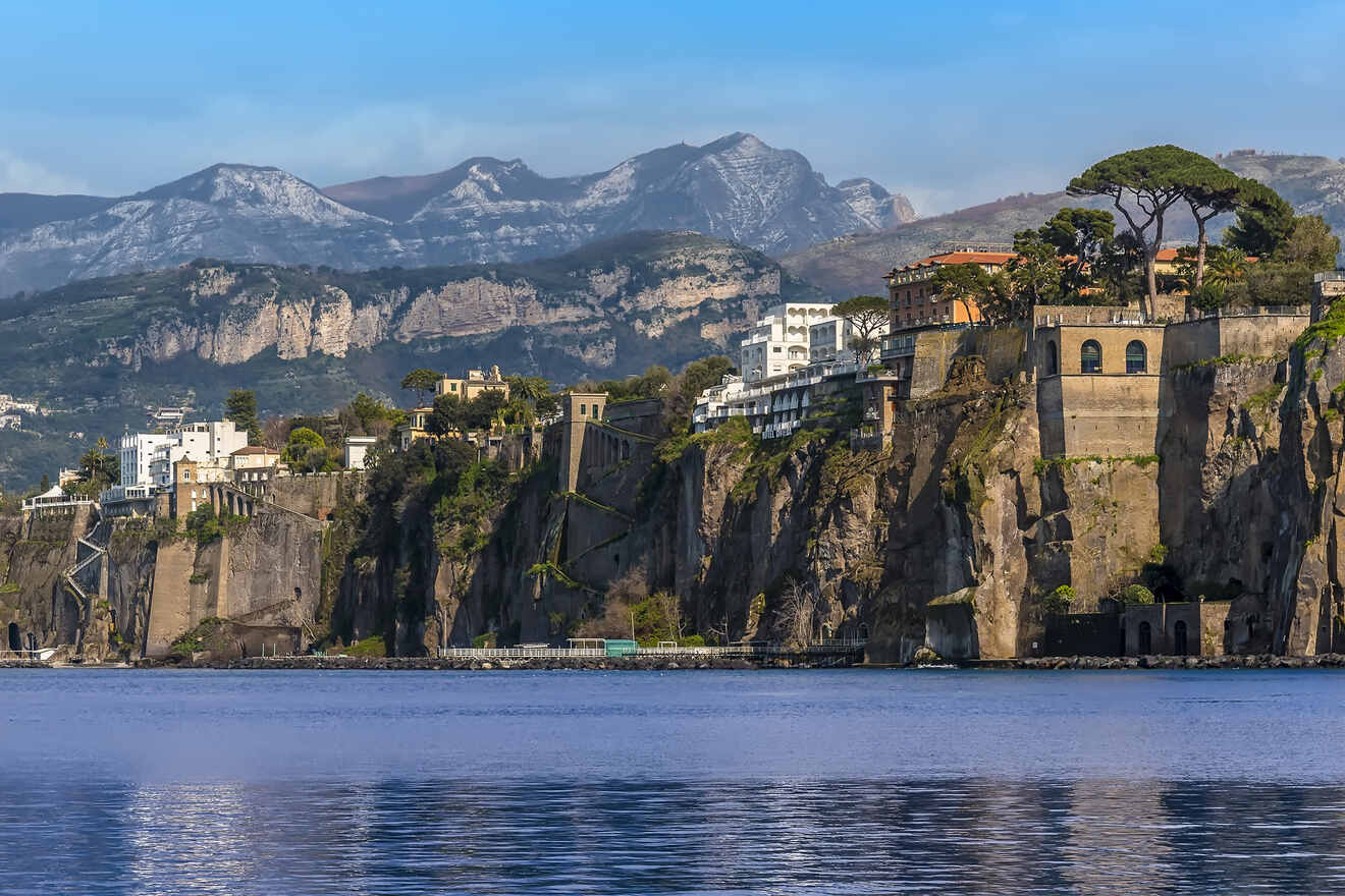 Coastal landscape of Sorrento with cliffs, buildings, and the sea, viewed from the water