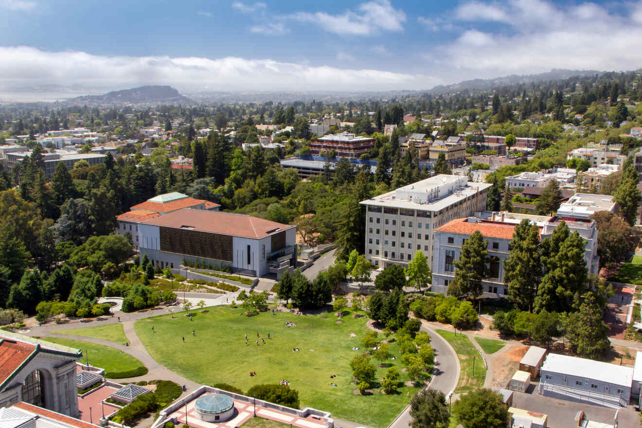 an aerial view of a campus with a green field