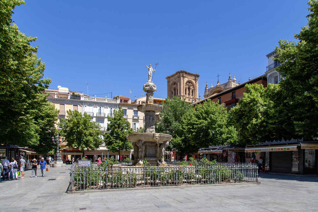 City square with a central ornate fountain, surrounded by bustling pedestrian areas, shaded by lush trees, against a backdrop of historical buildings and a clear blue sky