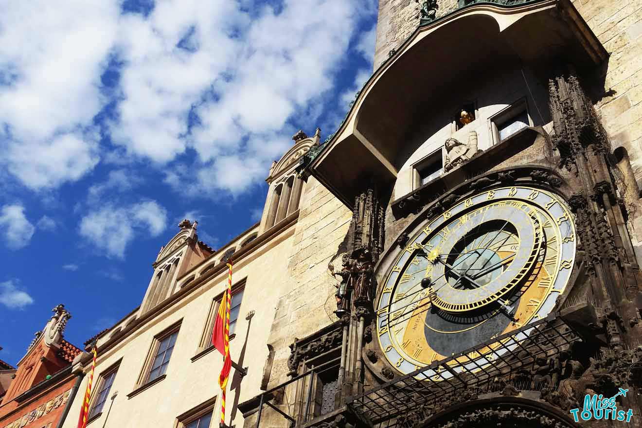 An ornate clock on the side of a building.