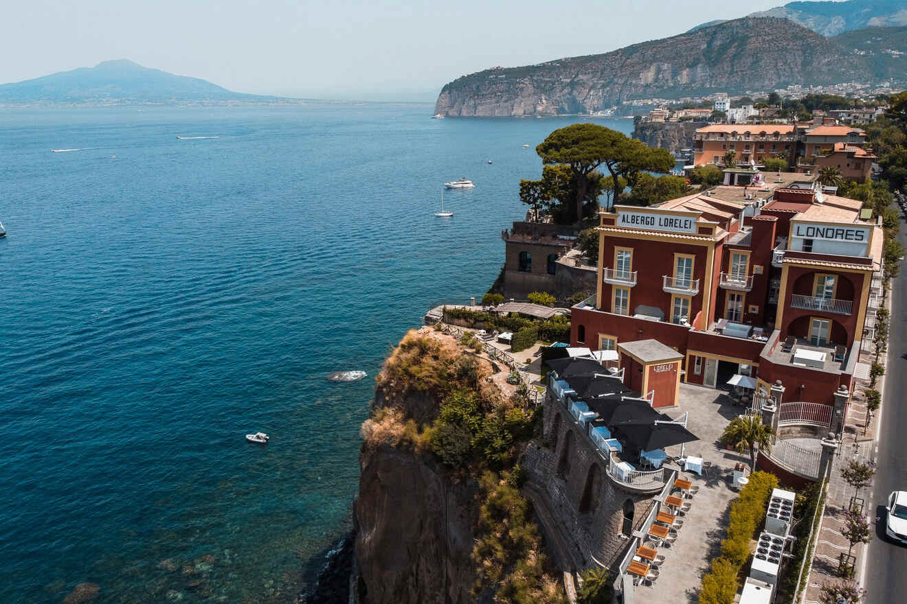 Aerial view of the Albergo Lorelei Londres hotel in Sorrento, with terraces overlooking the sea and a cliff in the background