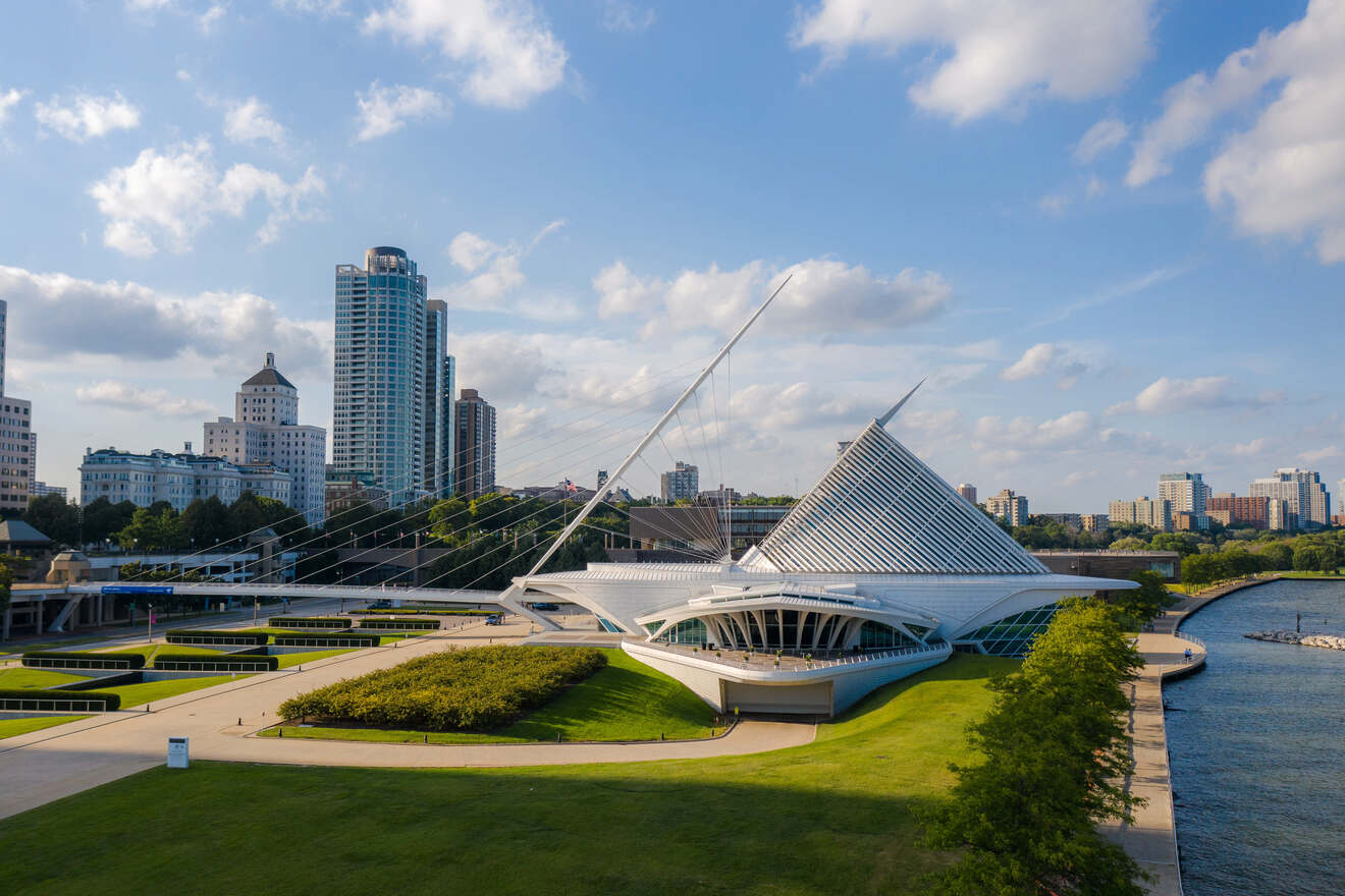 Architectural photograph of a modern art museum in Milwaukee with a dynamic white facade against a clear blue sky