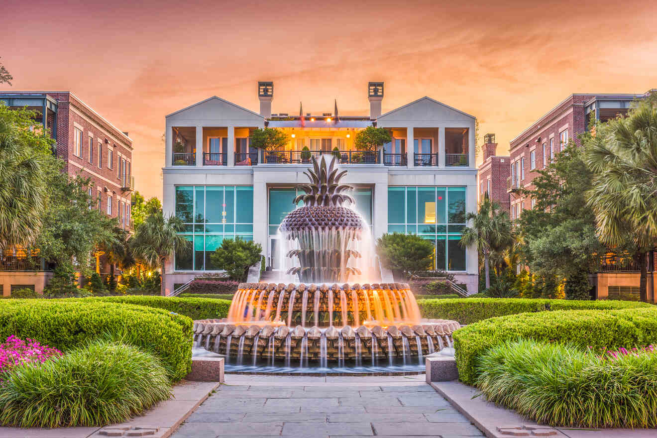 A picturesque view of Charleston's iconic pineapple fountain at Waterfront Park during sunset, with surrounding greenery and historic buildings in the background.