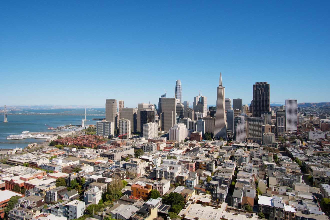 aerial view over the city with skyscrapers in the background with the ocean left side