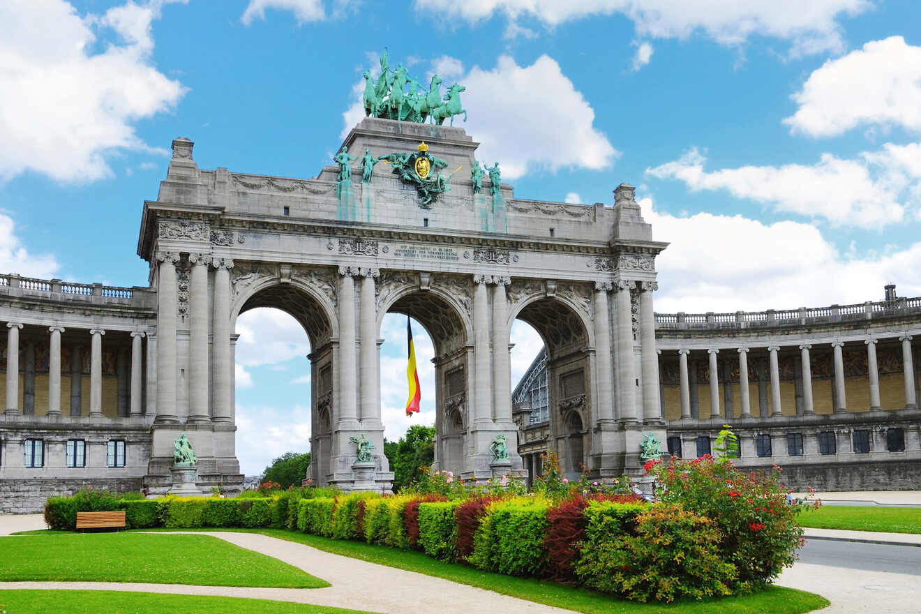 The Cinquantenaire Arch in Brussels with its impressive sculpture and columns, under a cloudy sky