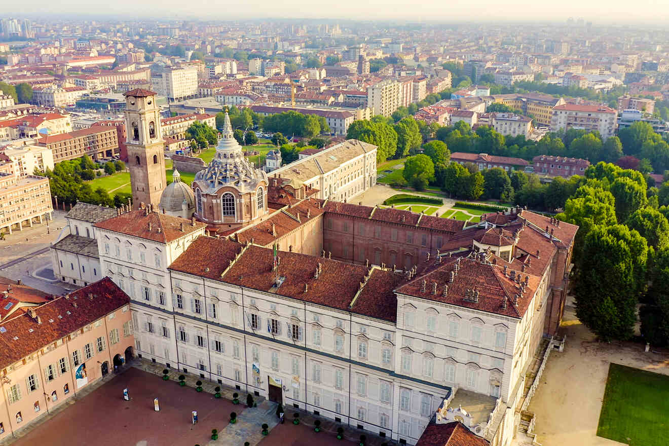 Aerial view of the Royal Palace of Turin with its historic architecture, spacious courtyards, and lush gardens.
