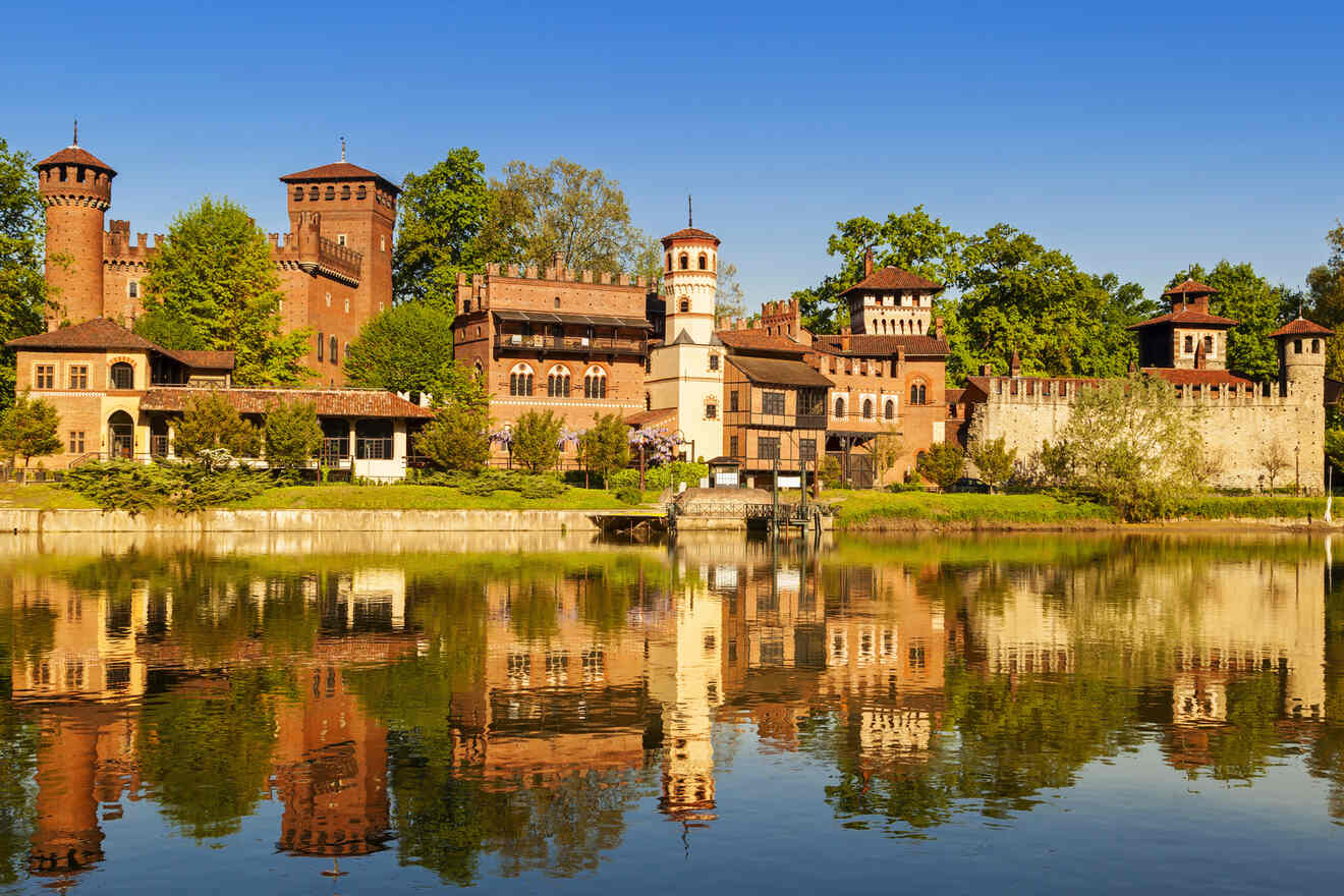 The medieval architecture of the Borgo Medievale reflected in the waters of the Po River on a clear day.
