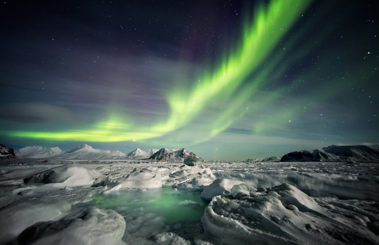 Northern lights above snow