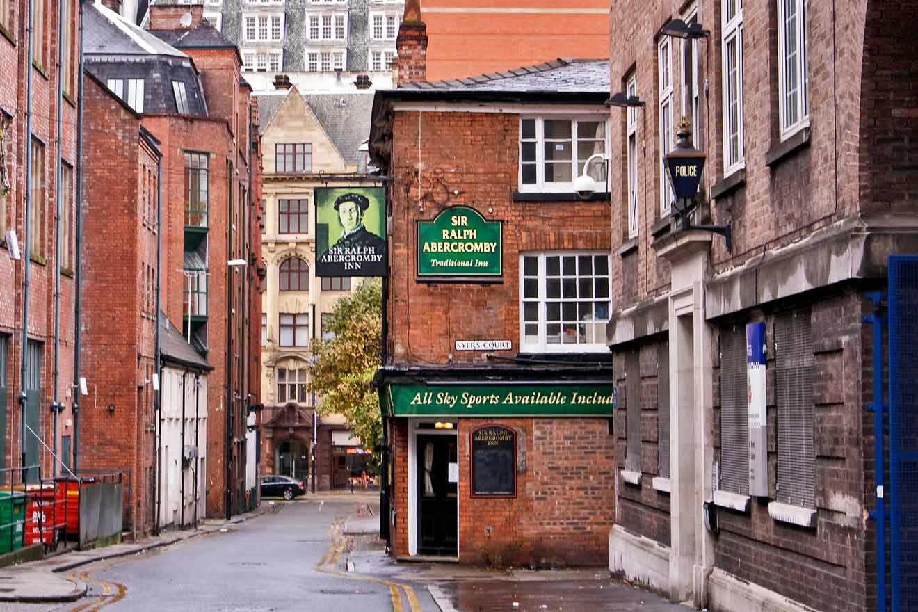 Traditional British pub, the Sir Ralph Abercromby Inn, located in a historic red-brick building on a quiet Manchester street