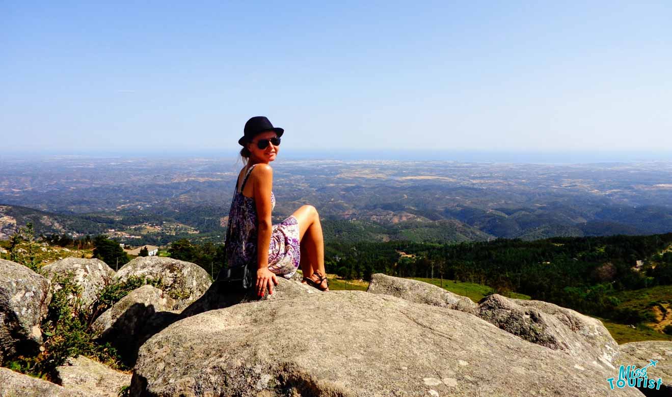 The writer of the post sitting on a rock offering panoramic view of the Algarve surroundings