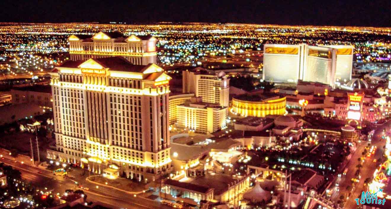 Nighttime view of Caesar's Palace Hotel in Las Vegas, brightly illuminated amidst the city lights