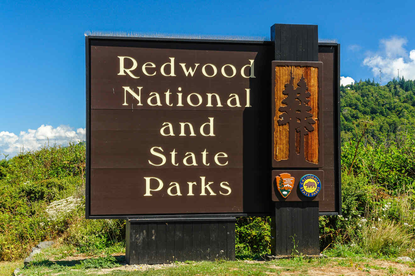 a sign that says redwood national and state parks