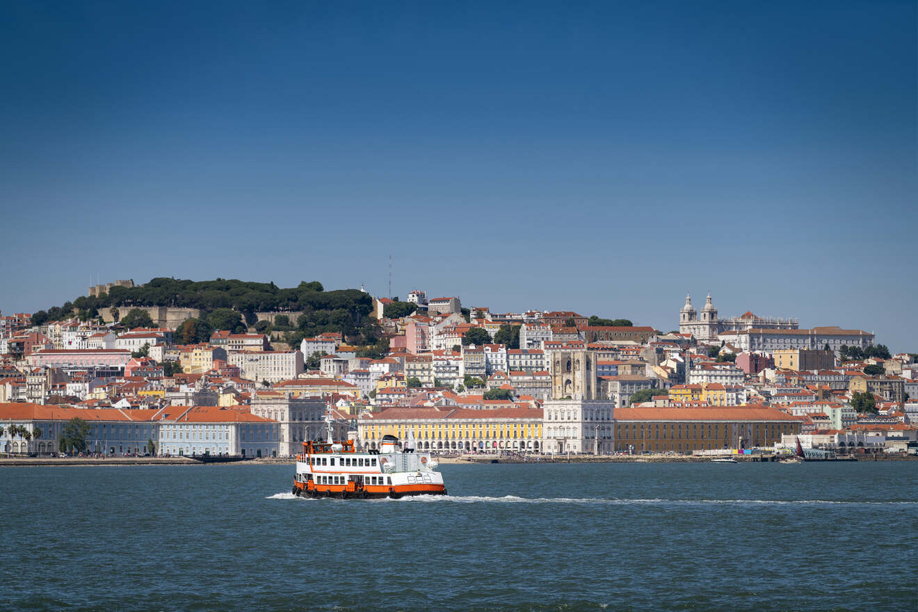 boat on the ocean and various buildings 