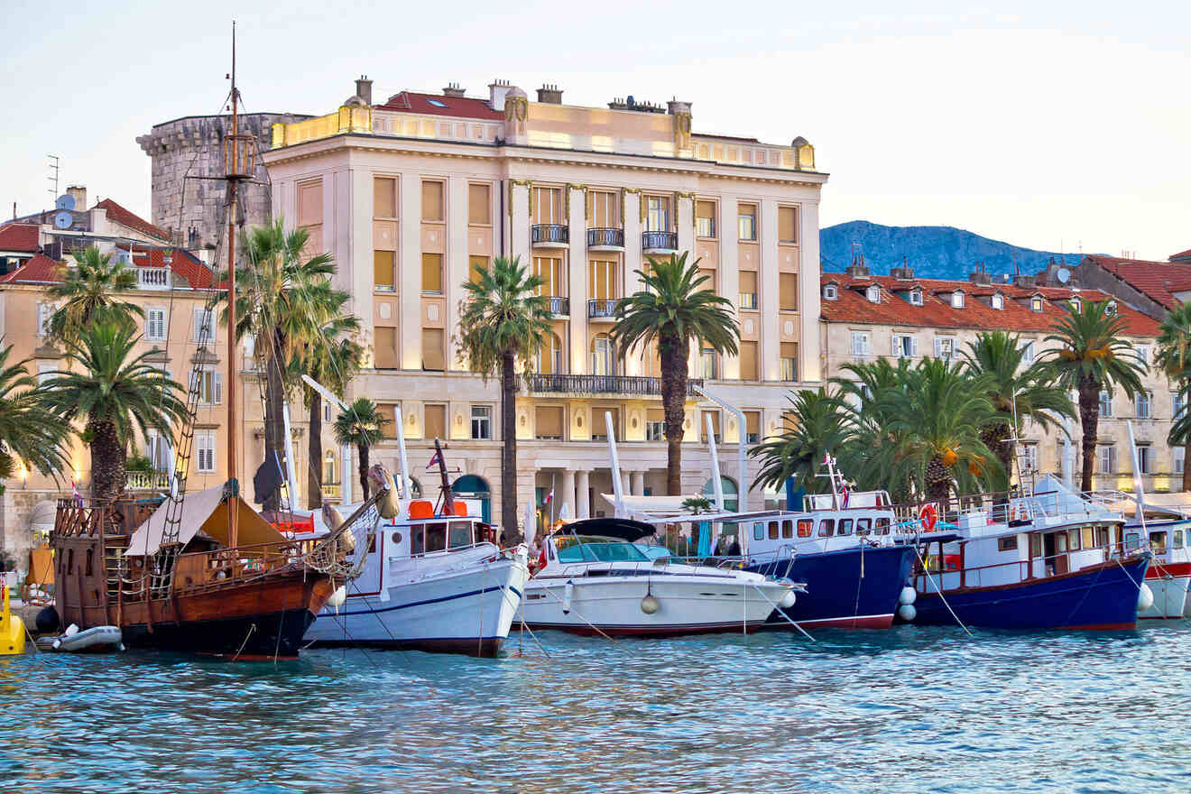 Waterfront scene featuring boats moored in the harbor against a backdrop of elegant buildings and palm trees in Split, Croatia