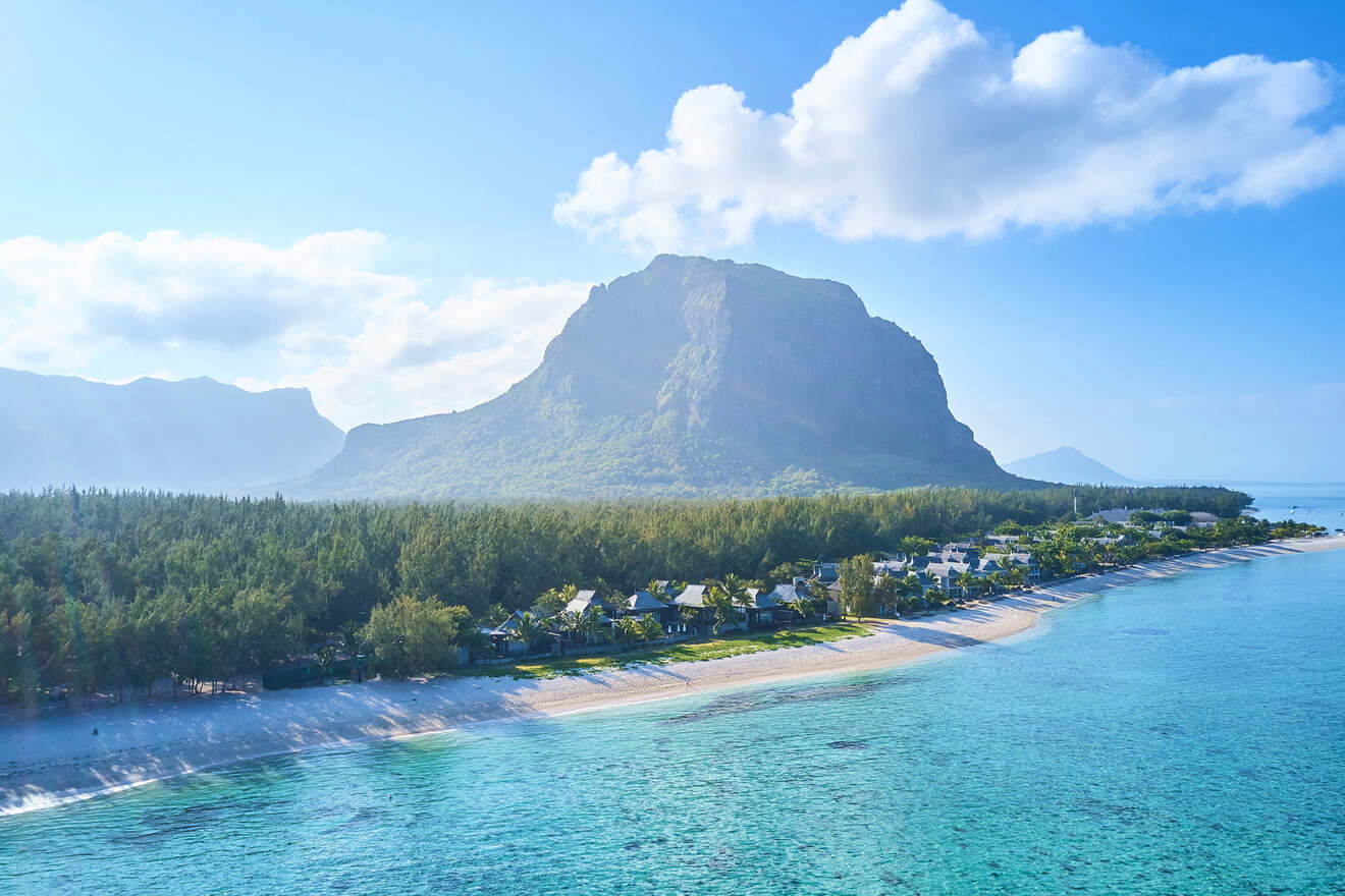 Aerial view of Le Morne Brabant in Mauritius, showcasing the iconic mountain, white sandy beaches, and turquoise sea, embodying tropical paradise.