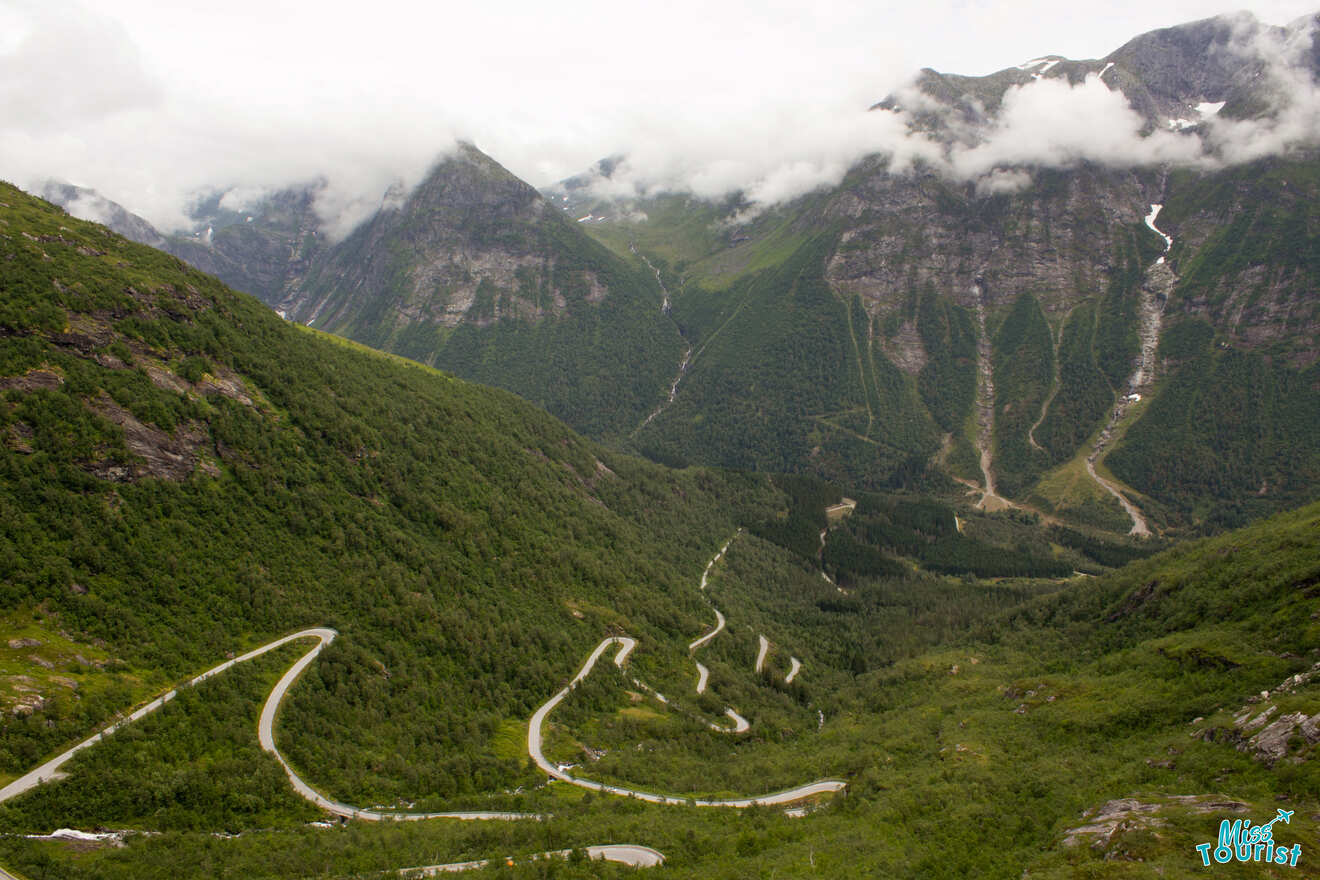 A windy road in green mountains, something to consider when you rent a car in Norway 