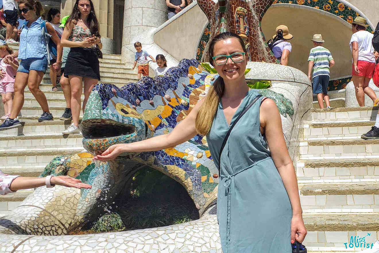 The writer of the post is standing in front of a fountain in barcelona.