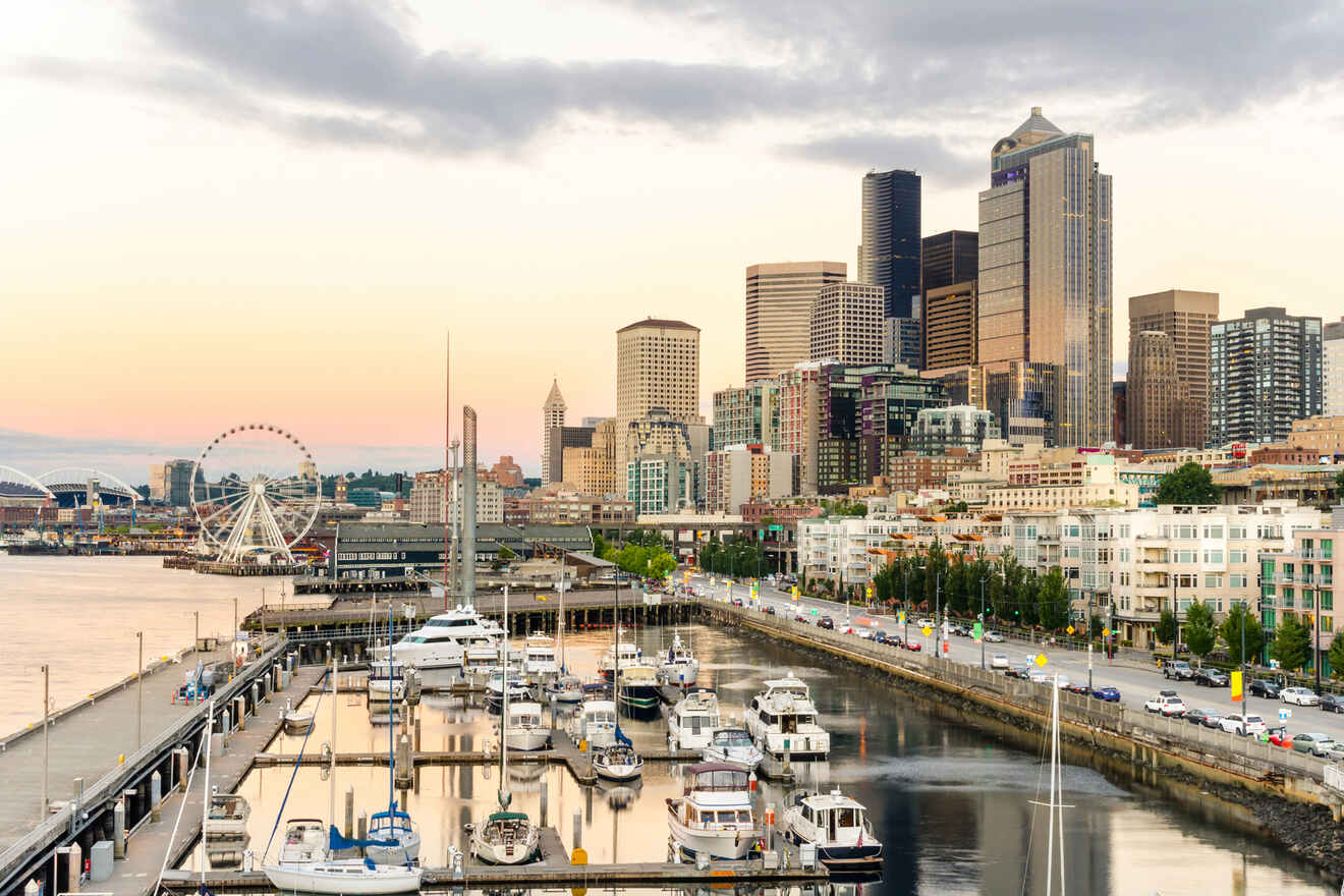 a harbor filled with lots of boats next to tall buildings