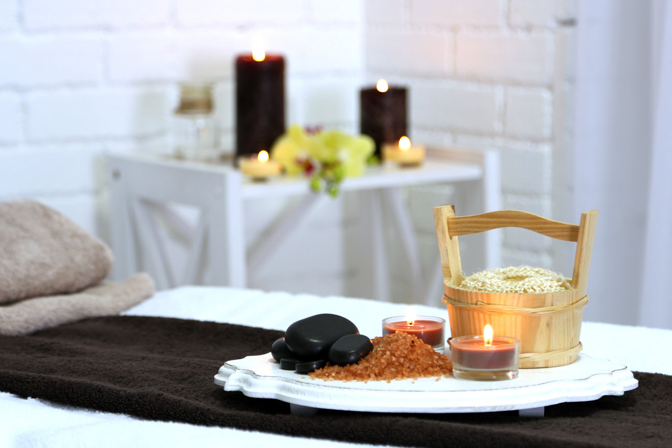 Spa bed with hot stones, salt and candles