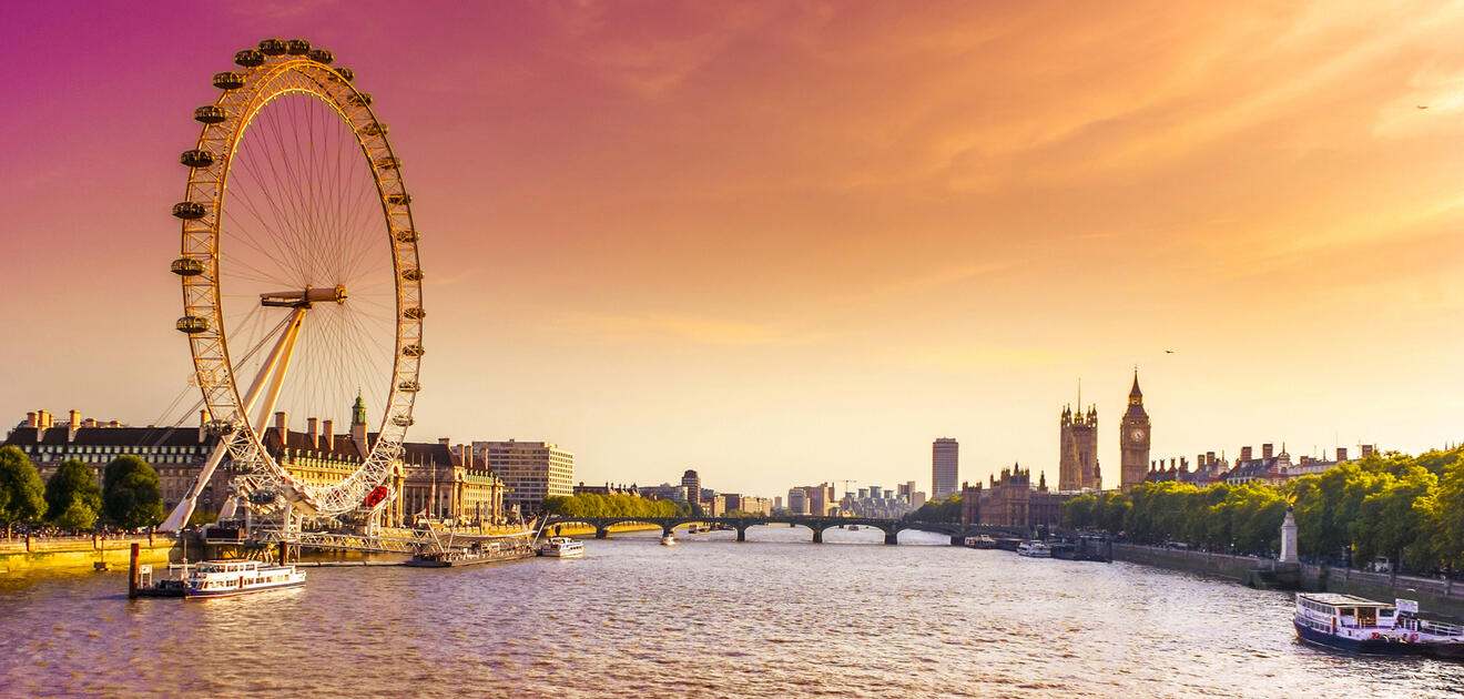 Panoramic view of London with the London Eye and Big Ben at sunset